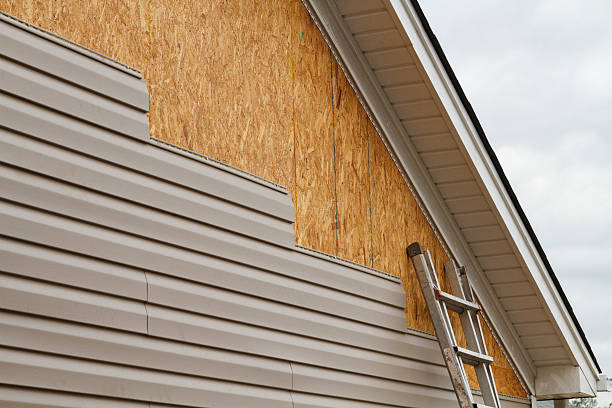 Professional Storm Damage Siding Repair technician working in Wilson's Mills, NC